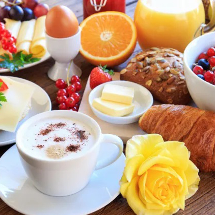 A picture of the fruits, croissants and coffee